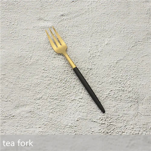 Elevate your dining experience with our Gold Cutlery Set – the epitome of sophistication and style. This flatware set, one of the best flatware sets in Australia, seamlessly combines the timeless allure of gold with sleek black accents. Crafted with precision, it adds a touch of glamour to any meal, making it a perfect choice for both everyday dining and special occasions. Upgrade your dining aesthetic with the finest gold cutlery set, enhancing every meal in style. black and gold tea fork