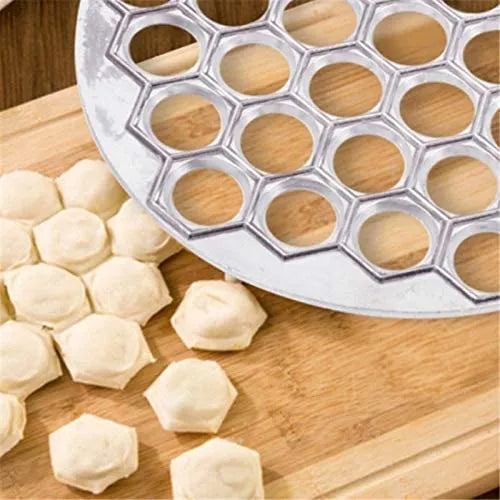 A revolutionary kitchen tool, our Dumpling & Ravioli Mold Set simplifies homemade dumpling and ravioli-making. Made from safe aluminum and durable stainless steel, this set enables effortless creation of 37 perfectly shaped dumplings at once. Enjoy easy cleanup and dishwasher-safe convenience. Elevate your culinary creations with this innovative tool from The Lime Online Kitchen Shop in Australia.