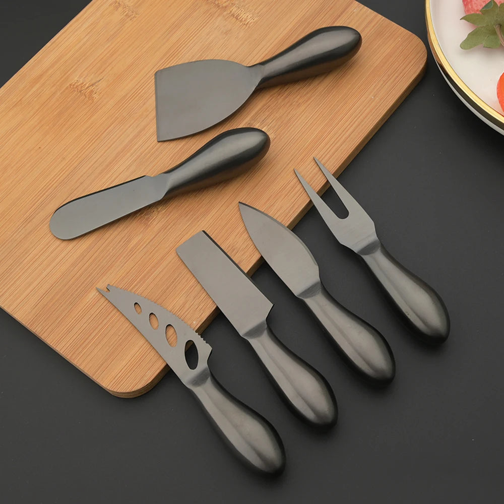 A premium Cheese Utensils Set featuring a pronged knife for semi-soft cheeses, a thin knife for slicing soft cheeses, a heart knife for cutting hard cheeses, a serving knife for elegant serving, a chisel knife for breaking crumbly cheeses, and a spreader knife for soft cheeses and pâtés. Crafted from high-quality stainless steel with ergonomic handles, these durable and easy-to-clean utensils add sophistication to any cheese platter.