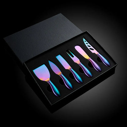 A premium Cheese Utensils Set featuring a pronged knife for semi-soft cheeses, a thin knife for slicing soft cheeses, a heart knife for cutting hard cheeses, a serving knife for elegant serving, a chisel knife for breaking crumbly cheeses, and a spreader knife for soft cheeses and pâtés. Crafted from high-quality stainless steel with ergonomic handles, these durable and easy-to-clean utensils add sophistication to any cheese platter.