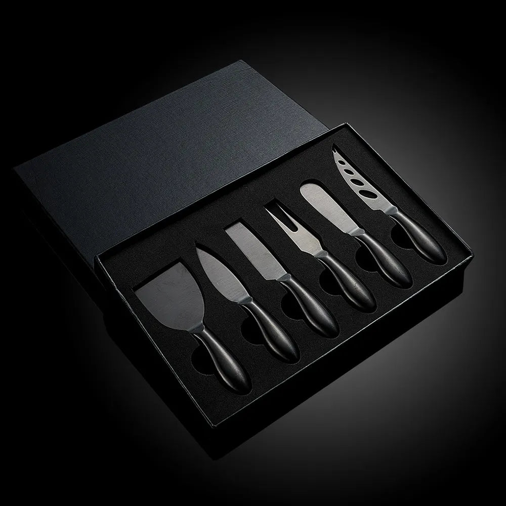 A premium Cheese Utensils Set featuring a pronged knife for semi-soft cheeses, a thin knife for slicing soft cheeses, a heart knife for cutting hard cheeses, a serving knife for elegant serving, a chisel knife for breaking crumbly cheeses, and a spreader knife for soft cheeses and pâtés. Crafted from high-quality stainless steel with ergonomic handles, these durable and easy-to-clean utensils add sophistication to any cheese platter.