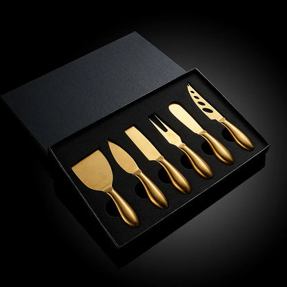 A premium Cheese Utensils Set featuring a pronged knife for semi-soft cheeses, a thin knife for slicing soft cheeses, a heart knife for cutting hard cheeses, a serving knife for elegant serving, a chisel knife for breaking crumbly cheeses, and a spreader knife for soft cheeses and pâtés. Crafted from high-quality stainless steel with ergonomic handles, these durable and easy-to-clean utensils add sophistication to any cheese platter.