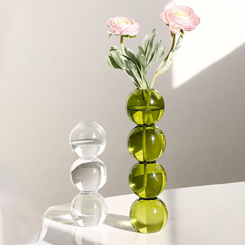 The Glass Bloom Vase, a transparent and sleek flower vase with a subtle bubble pattern, adds sophistication to any home decor. This versatile glass vase beautifully displays your favorite blooms, creating a stylish focal point in your living space, for home decor in Australia.